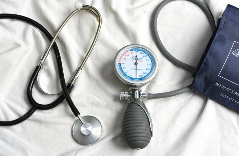 a stethoscope laying on top of a bed next to a medical bag